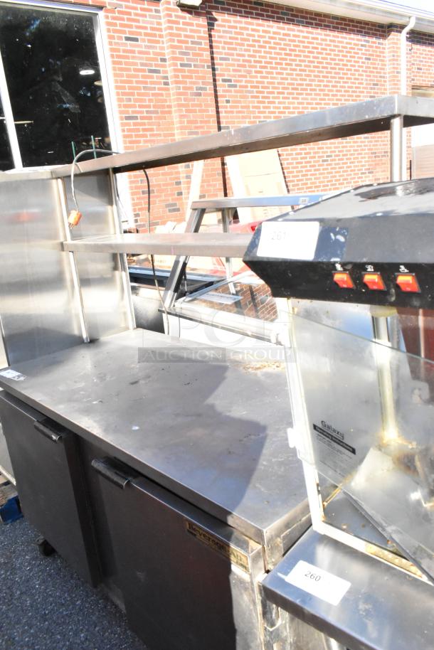Beverage Air WTR60A stainless steel work top cooler with two doors, two-tier shelf, and commercial casters. 115V, 1 Phase.