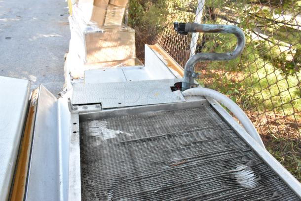 Harford Walk In Box with Bohn evaporator fan, 115V, 1 phase. Visible wear on metal surface, cables attached.