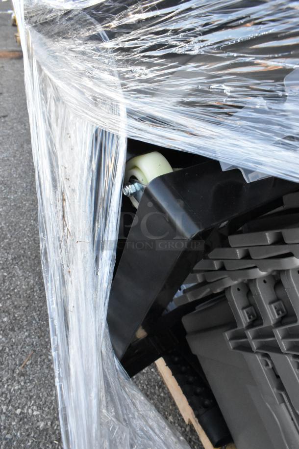 Pallet of wrapped items including gray poly bins and floor mats, in scratch and dent condition, ready for auction.