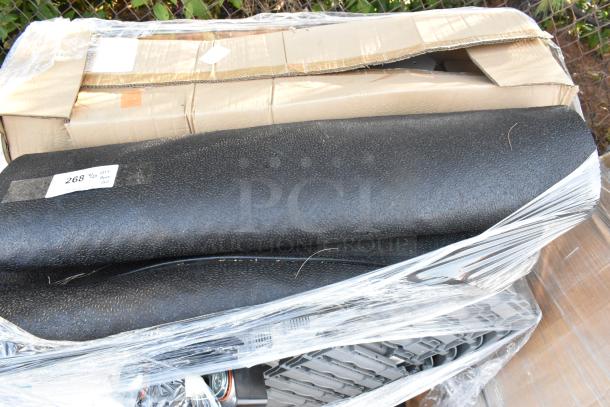 20 brand new scratch and dent items, including gray poly bins and a floor mat, wrapped in plastic. Label shows "QTY: 20."