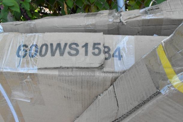 Damaged cardboard box labeled "600WS1584," likely containing Regency 18-Gauge Stainless Steel 15" x 84" Solid Wall Shelf.