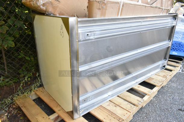 Brand new scratch and dent stainless steel counter on a pallet, minor scratches visible, labeled "S36."
