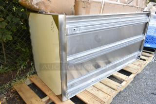 Brand new scratch and dent stainless steel counter on a pallet, minor scratches visible, labeled "S36."