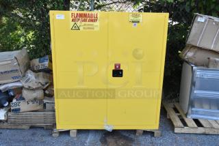 BRAND NEW Eagle 5510X Yellow Safety Cabinet, 110 Gal, 2 self-closing doors & shelves, with scratch and dent. Flammable label visible.
