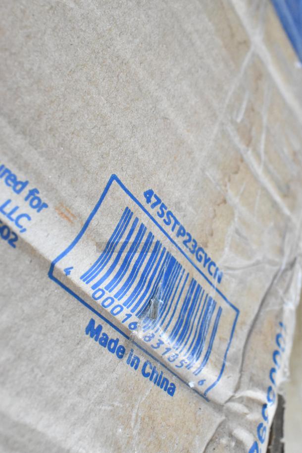 Cardboard box showing a barcode with numbers, "Made in China," and code "475STP23GYCI." Visible rough texture and minor creases.