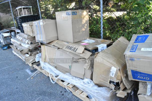 Pallet of 6 new scratch and dent items, including a table and wall cabinet, in damaged boxes with visible labels.