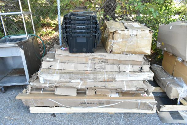 15 brand new scratch and dent items, including a table, wire shelf, and drying rack, in original packaging.