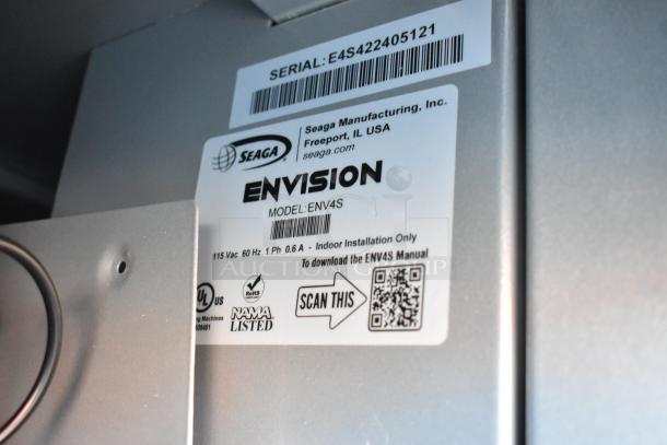Seaga ENV4S Vending Machine label showing model, 115V, 1 Ph specs, and QR code for manual download.
