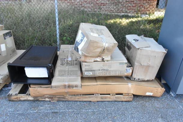 8 brand new scratch and dent items from Seaga, including a work table, over shelf, and dishwasher stand, in original packaging on a pallet.