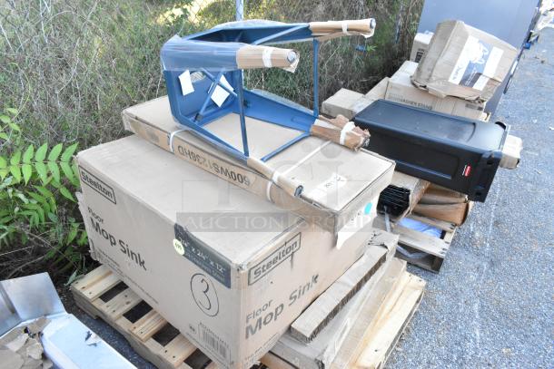 5 brand new Seaga items including a blue stool, sheet pan, and Steelton mop sink in original packaging, on pallets.
