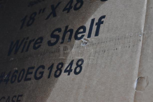 Seaga brand wire shelf in cardboard packaging, marked 18" x 48", model #460EG1848, showing minor packaging damage.