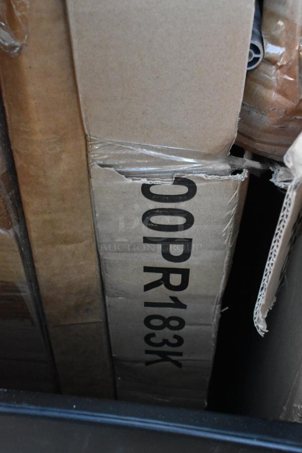 11 new scratch and dent items in boxes, including Seaga pan racks. Box shows "00PR183K" marking.