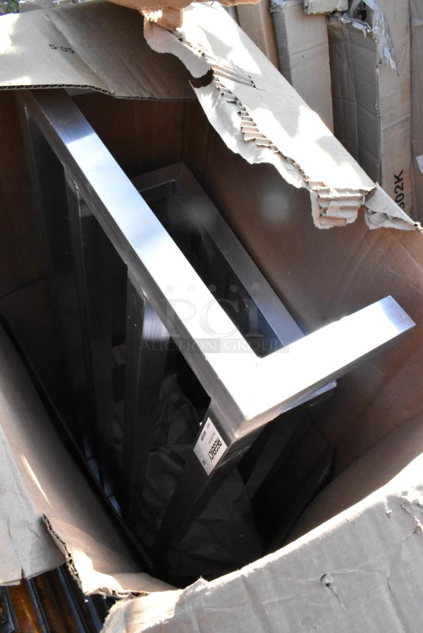 Two new Regency aluminum dunnage racks in a cardboard box, models 600DUN2048 and 600DUN2060, scratch and dent condition.