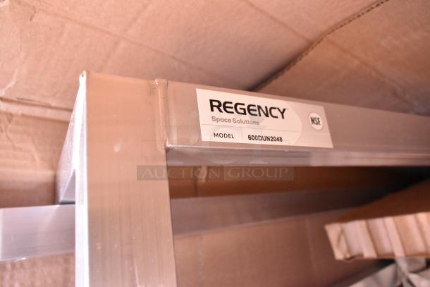 Brand new Regency 48"x20"x8" aluminum dunnage rack, model 600DUN2048, 1685 lb. capacity, visible label, minor scratches.