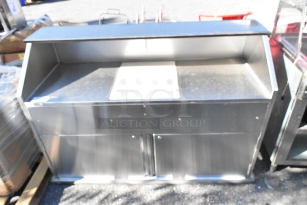 Brand new Regency 63" stainless steel portable bar with dual speed rails, ice bin, and removable cover. Minor scratches.