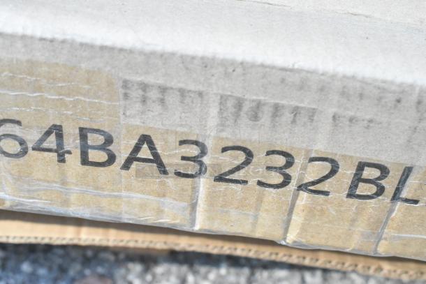 Close-up of a cardboard box with bold black text "64BA3232BL" printed on the side, part of a lot of 15 new boxes.