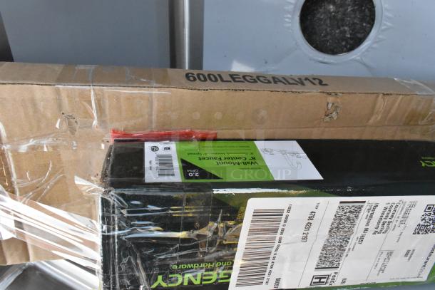 Cardboard packaging of Steelton 522CS11818N Stainless Steel Single Bay Sink, showing shipping labels and minor damage.