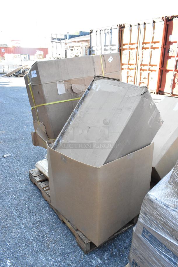 Eight brand new boxes on pallets, containing counter, cabinet, and utility cart. Boxes appear sealed, ready for shipment.