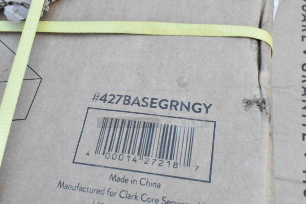 Cardboard box label showing barcode and item number #427BASEGRNGY, indicating contents include an umbrella base.