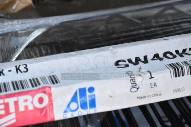 Boxes with new Metro wire shelves, labeled "SW40K3," Made in China. Includes tart pans. Quantity 12.