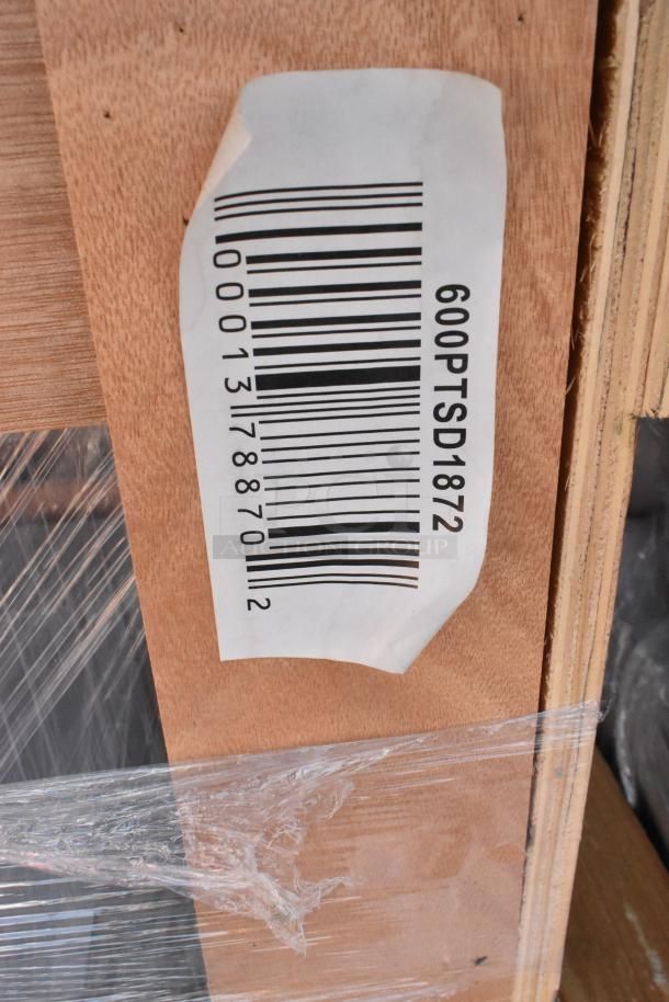 Barcode label reads "600PTSD1872" on wooden package, wrapped in plastic, indicating stainless steel pass-through shelf.