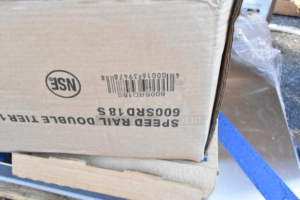 Cardboard box displaying barcode and text "600SRS18S Speed Rail Double Tier". Part of a 12-box auction lot.