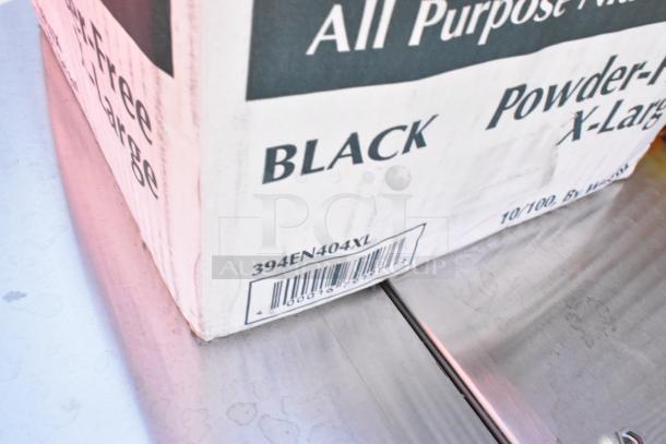 Box of Noble Products Nitrile Black All-Purpose Gloves, Extra Large, 4 Mil Thick, Powder-Free, 394EN404XL Label Visible.
