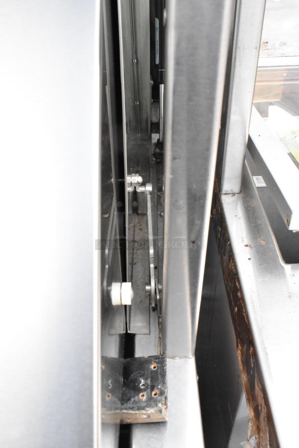Duke SWD600-600FL metal prep line detail, showing stainless steel components and wear, 120V, 1 phase.