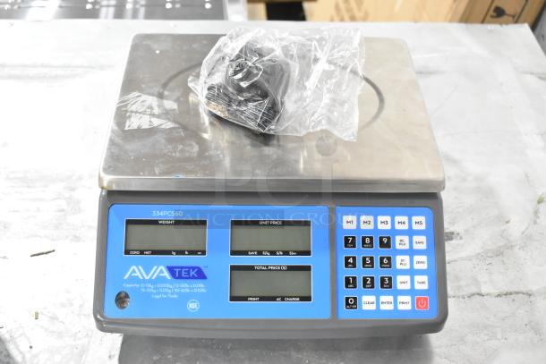 2025 AvaTek 334PCS60 60 lb. digital price computing scale, new with scratch and dent. Displays, keypad, stainless top visible.