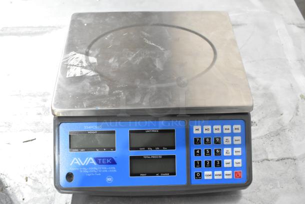 BRAND NEW AvaTek 334PCS60 60 lb. digital price computing scale, minor scratches visible, blue LCD display, numeric keypad.