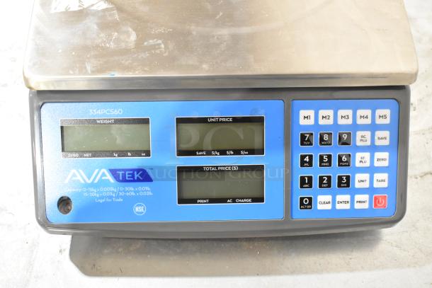 Brand new AvaTek 334PCS60 60 lb. digital price computing scale, showing minor scratches. Features digital display and keypad.