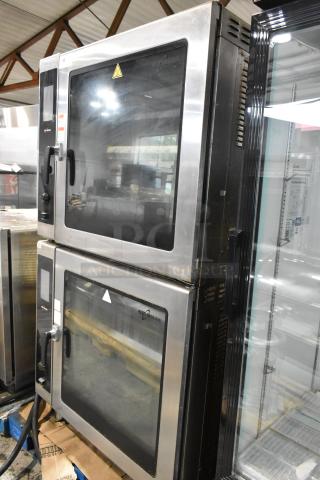 2 Alto Shaam AR-7T stainless steel rotisserie ovens, 7 spits, self-cleaning, electric, 208V, commercial-grade condition.