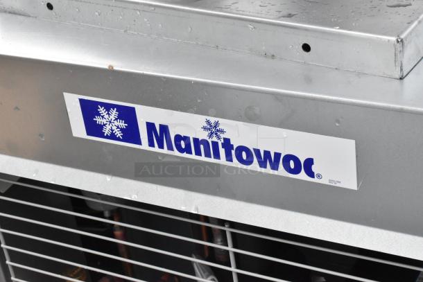 Brand new Manitowoc remote compressor for ice head, featuring a scratch and dent condition. Visible brand logo.