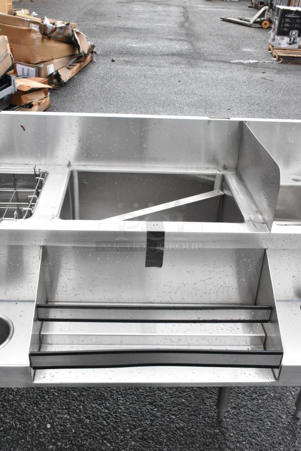 Regency 60" stainless steel cocktail station, new with dents, featuring liquor display rack and cold plate, for sale.