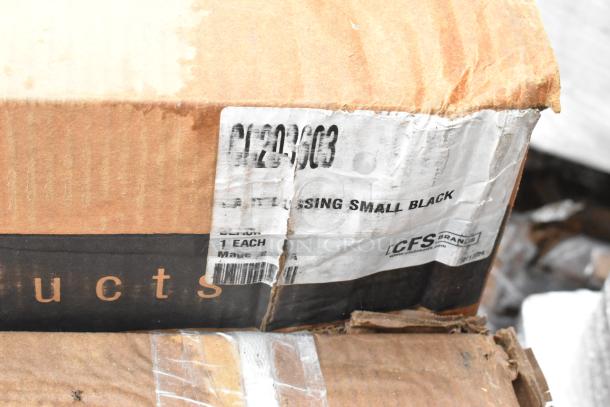 Cardboard box with visible label showing "DRESSING SMALL BLACK" and "CFS Brands." The box appears worn.