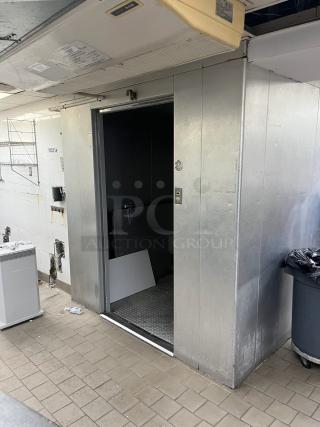 8'x12' Harford walk-in freezer box with Bohn 115V, 1 phase evaporator fan, metallic exterior, open door.
