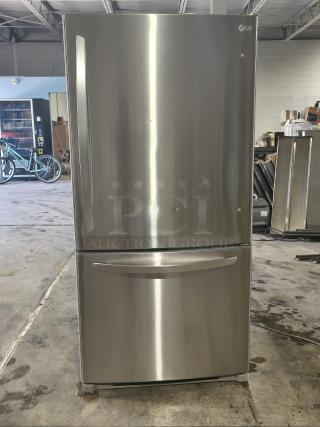 LG 22.4 cu ft stainless steel refrigerator with single door, pull-out bottom freezer. Clean condition, visible LG logo.
