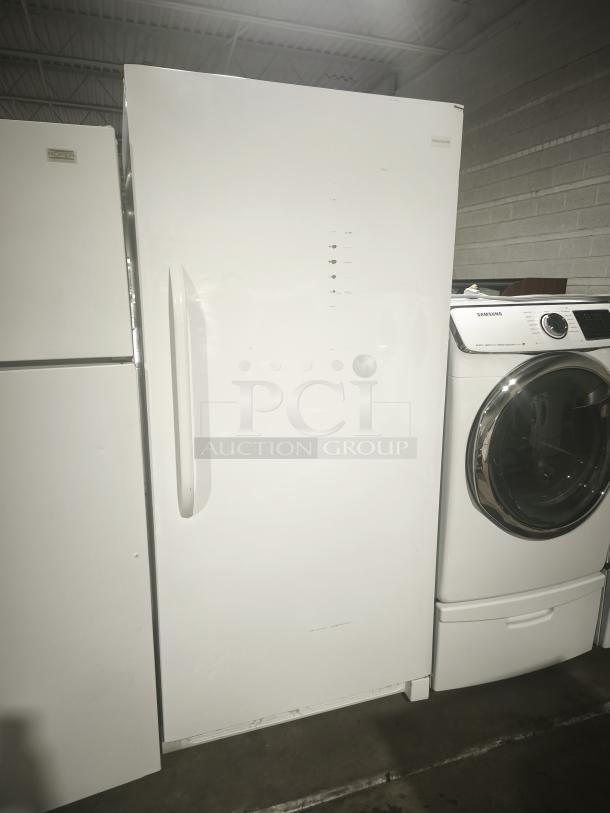 Frigidaire 20.2 cu. ft. all-freezer, model FFFH20F2QW, with white exterior, adjustable shelves, door racks, and dial control.