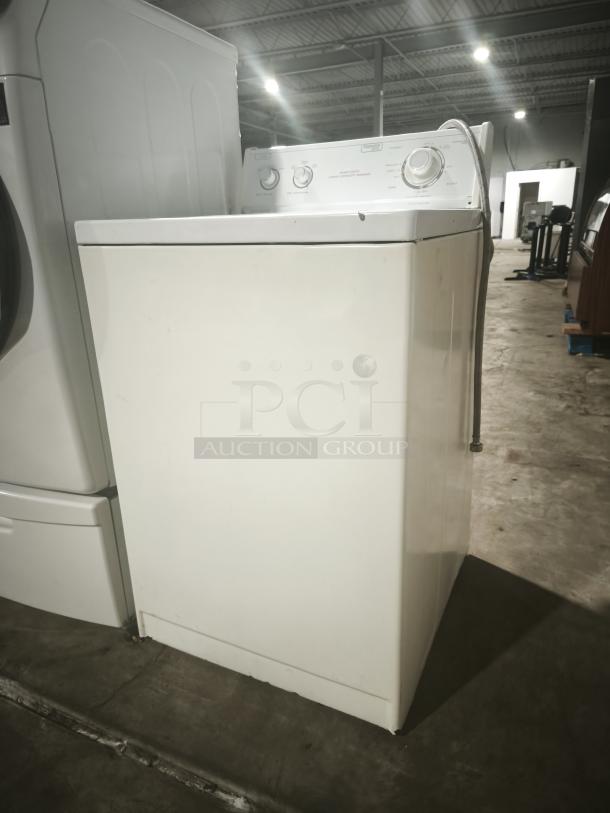 Estate 2-Speed Automatic Washer, top-load, white, good condition. Control panel with knobs for settings. Ideal for laundry use.