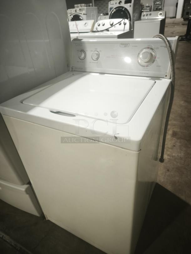 Estate 2-Speed Automatic Washer, top-load, white, visible control knobs, minor wear, auction item.