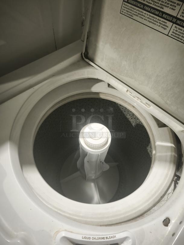 Estate 2-Speed Automatic Washer, top-load design, visible wear, open lid showing agitator and interior.