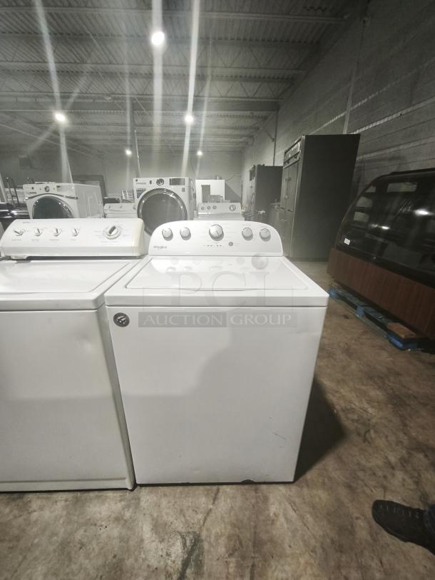 Whirlpool WTW5000DW 4.3 cu.ft top load washer, 12 cycles, quick wash feature, good condition, visible control panel.