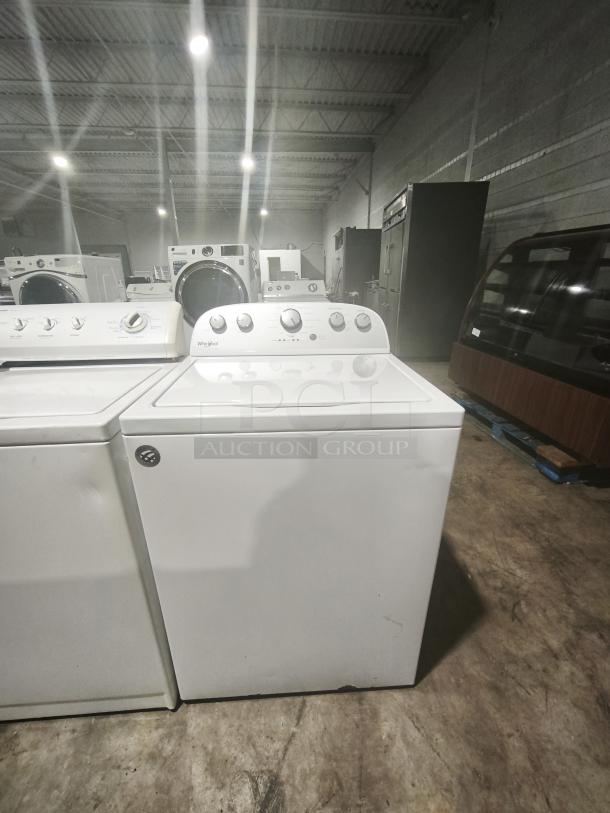 Whirlpool 4.3 cu.ft top load washer, model WTW5000DW, features 12 cycles, Quick Wash. Minor blemish on the front panel.
