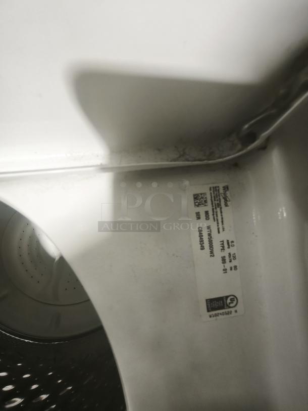 Whirlpool 4.3 cu.ft top load washer, model WTW5000DW, interior detail with model label, good condition.