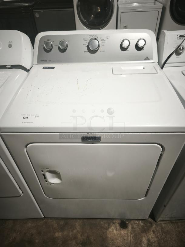Maytag 7.0 cu. ft. dryer, model MEDX655DW. Features sanitize cycle. Visible minor wear. Control knobs intact.