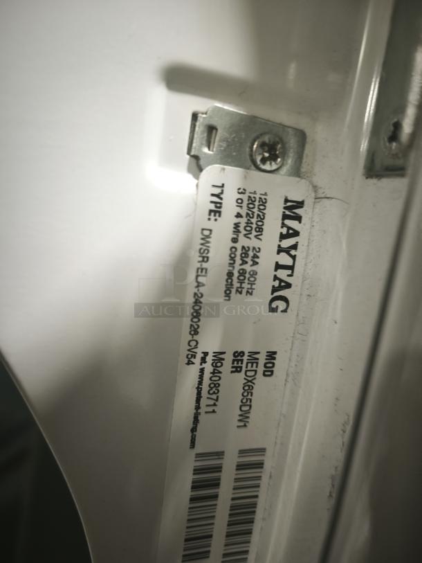 MAYTAG 7.0 cu. ft. Dryer label showing model MEDX655DW, sanitize cycle feature, voltage specs, and serial number.