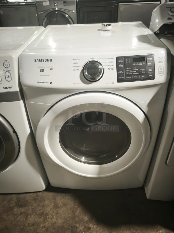 SAMSUNG 7.5 cu. ft. electric dryer, model dv42h5000ew/a3, in white. Features multiple settings, Moisture Sensor, good condition.