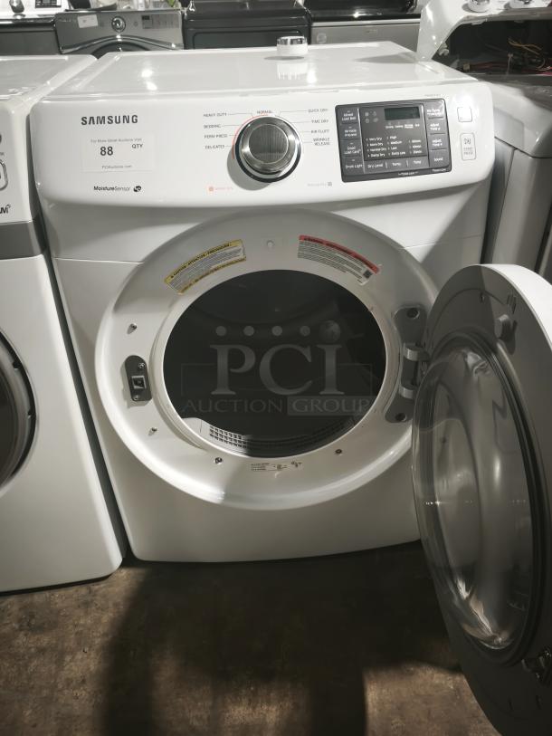 SAMSUNG 7.5 cu. ft. electric dryer, model dv42h5000ew/a3, in white. Features moisture sensor, open door view showing interior.