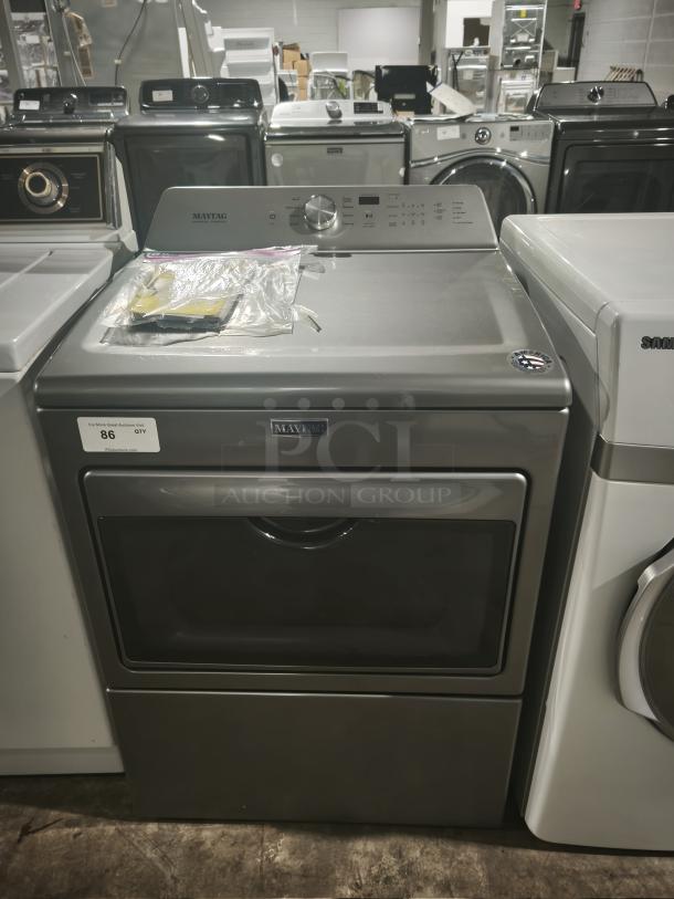 Maytag 27" electric dryer, model MEDB765FC0, in metallic slate. Features IntelliDry® sensor, 7.4 cu. ft. capacity.