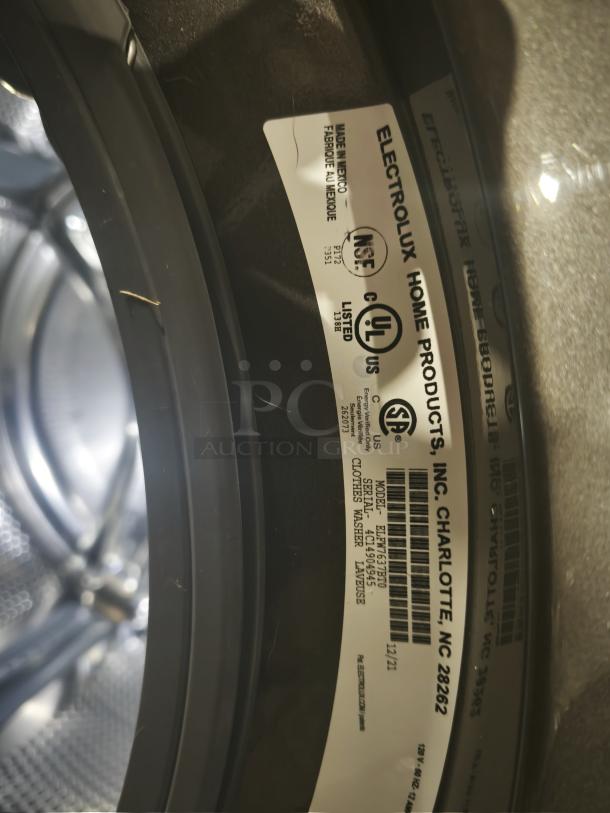 ELECTROLUX ELFW7637BT0 front load washer, 4.5 cu.ft. capacity, ENERGY STAR certified, model and serial labels visible.